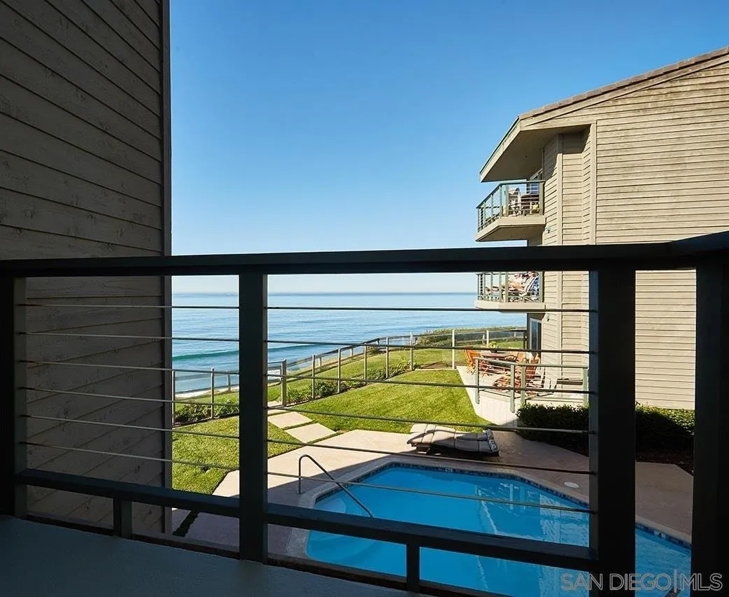 940 Sealane Drive, Unit 5 Encinitas, CA 92024 - Photo 8 of 49 a view of a balcony with floor to ceiling windows with wooden floor