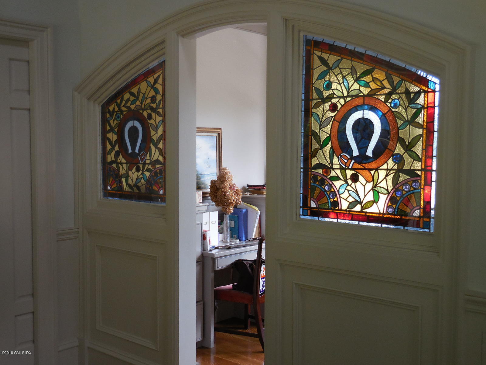 50 Hillside Drive Greenwich, CT 06830 - Photo 14 of 16 a painting on a wall next to a window