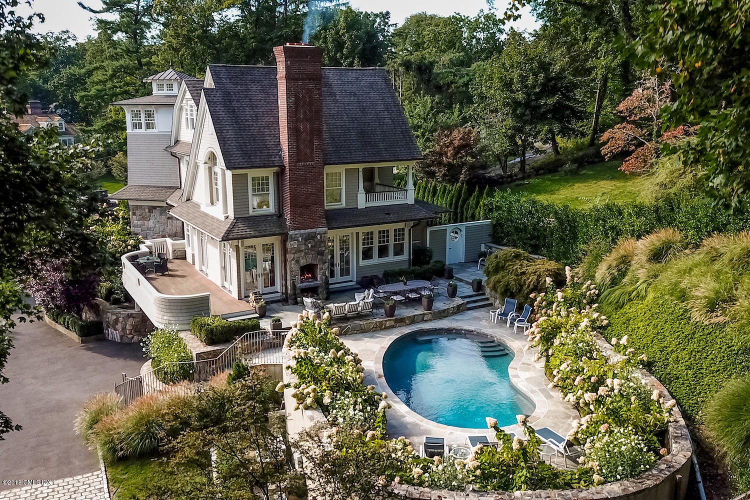 50 Hillside Drive Greenwich, CT 06830 - Photo 2 of 16 a view of a house with a yard patio and sitting area
