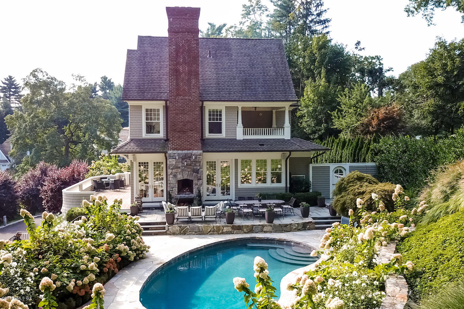 50 Hillside Drive Greenwich, CT 06830 - Photo 6 of 16 a view of a house with swimming pool and sitting area