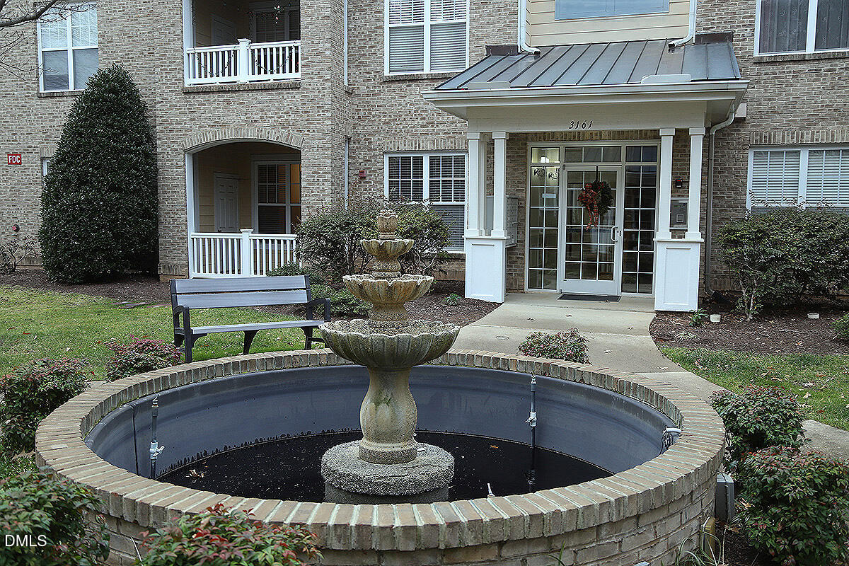 3161 Hemlock Forest Circle, Unit 101 Raleigh, NC 27612 - Photo 2 of 21 a view of house with a fountain back yard