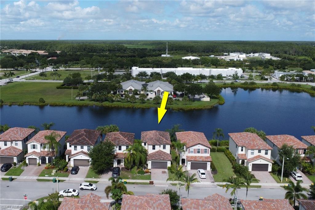 5289 Beckton Road Immokalee, FL 34142 - Photo 26 of 37 an aerial view of a house with a lake view