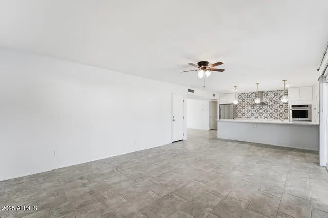 a view of a kitchen with electric appliances