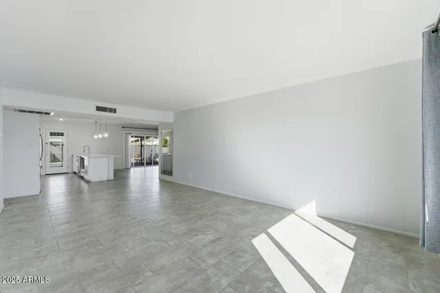 a bathroom with a toilet a sink a mirror a bathtub and vanity