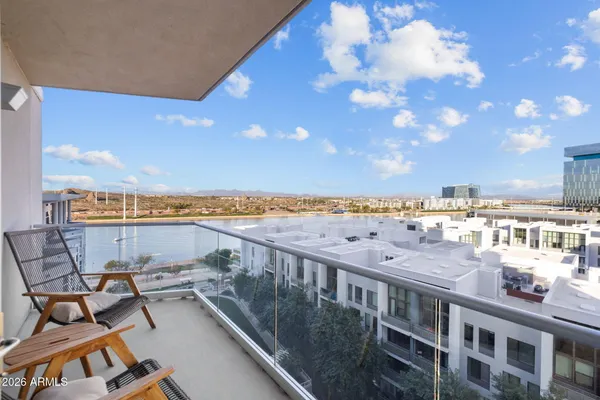 a living room with a sink and furniture