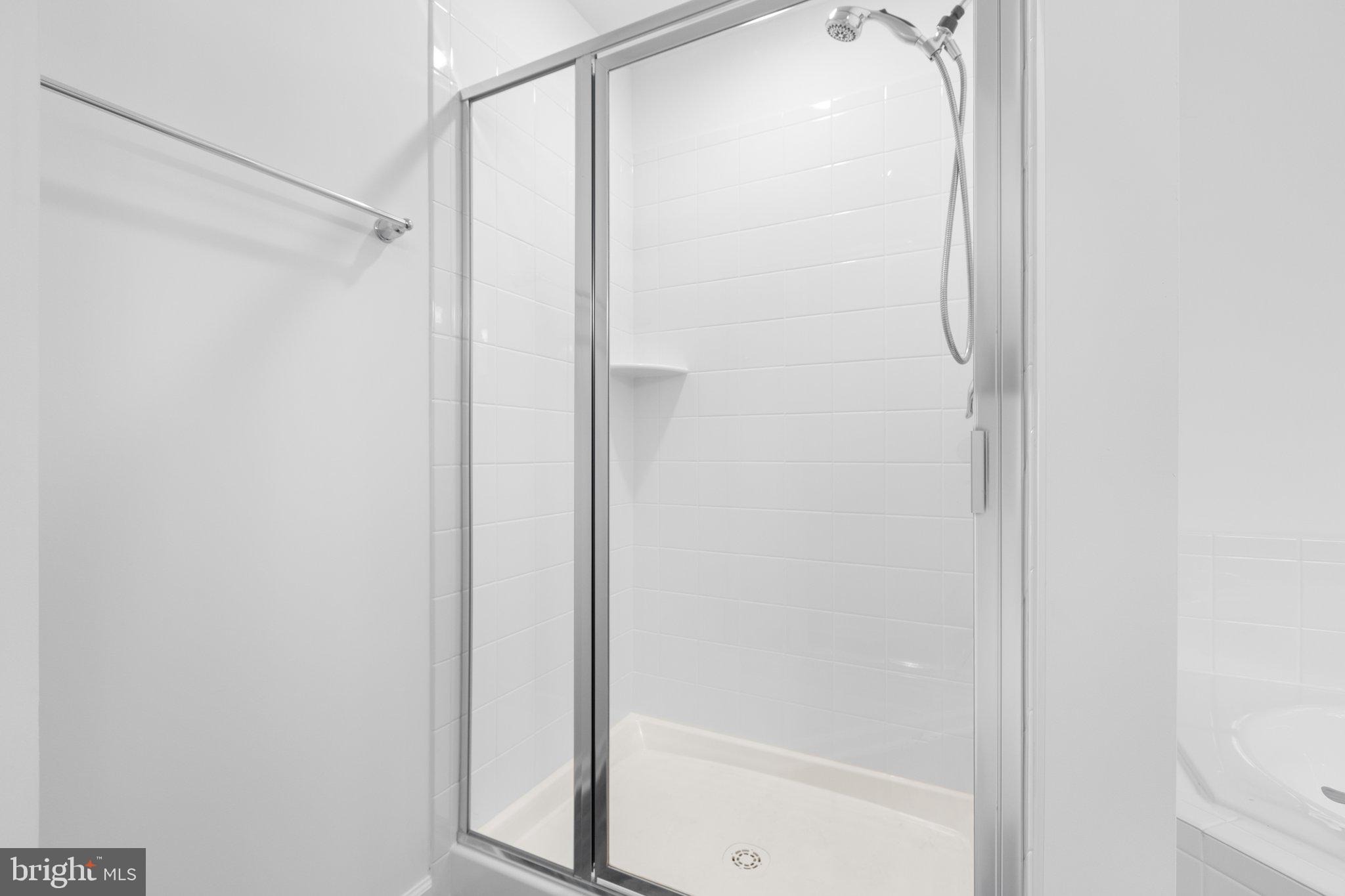 282 Circle Lane Colonial Beach, VA 22443 - Photo 14 of 57 a bathroom with a glass shower door