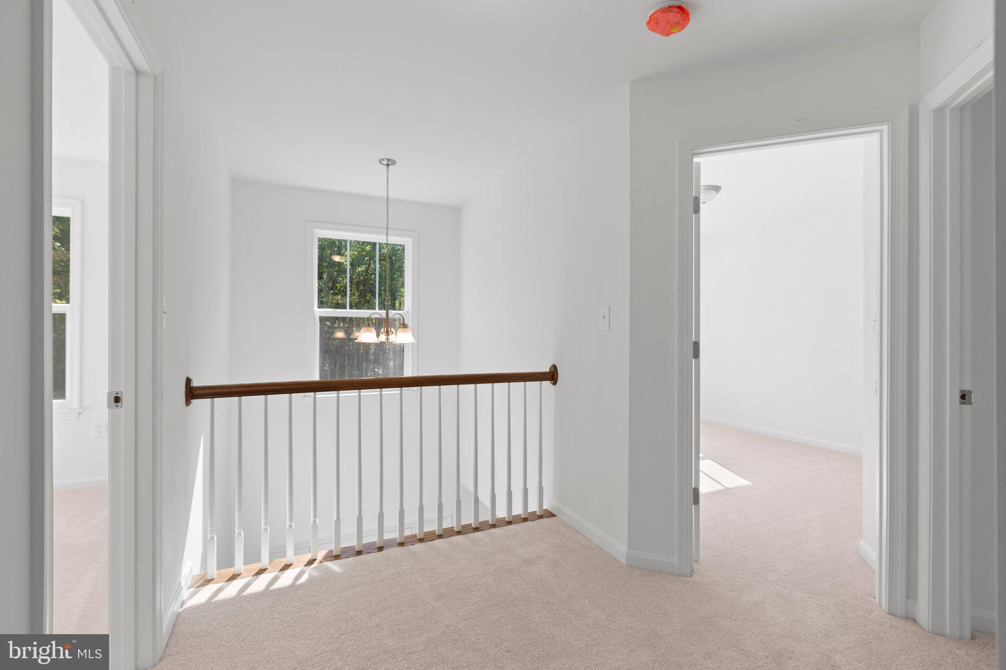282 Circle Lane Colonial Beach, VA 22443 - Photo 23 of 57 a view of a hallway to rooms and stairs