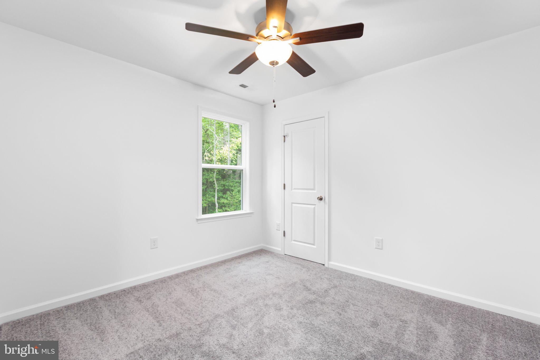 282 Circle Lane Colonial Beach, VA 22443 - Photo 53 of 57 an empty room with a window and a fan