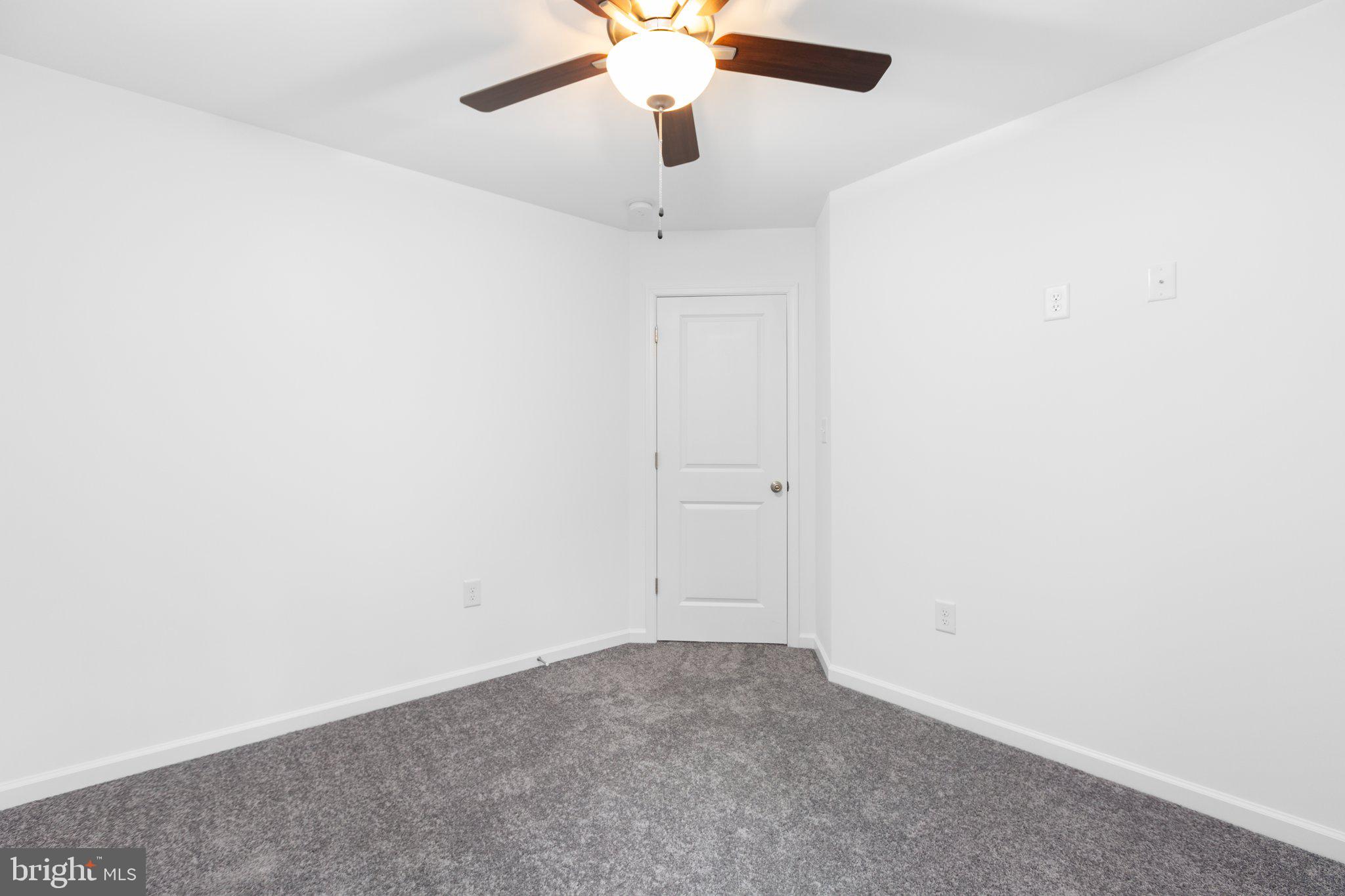 282 Circle Lane Colonial Beach, VA 22443 - Photo 54 of 57 an empty room with a ceiling fan and a window