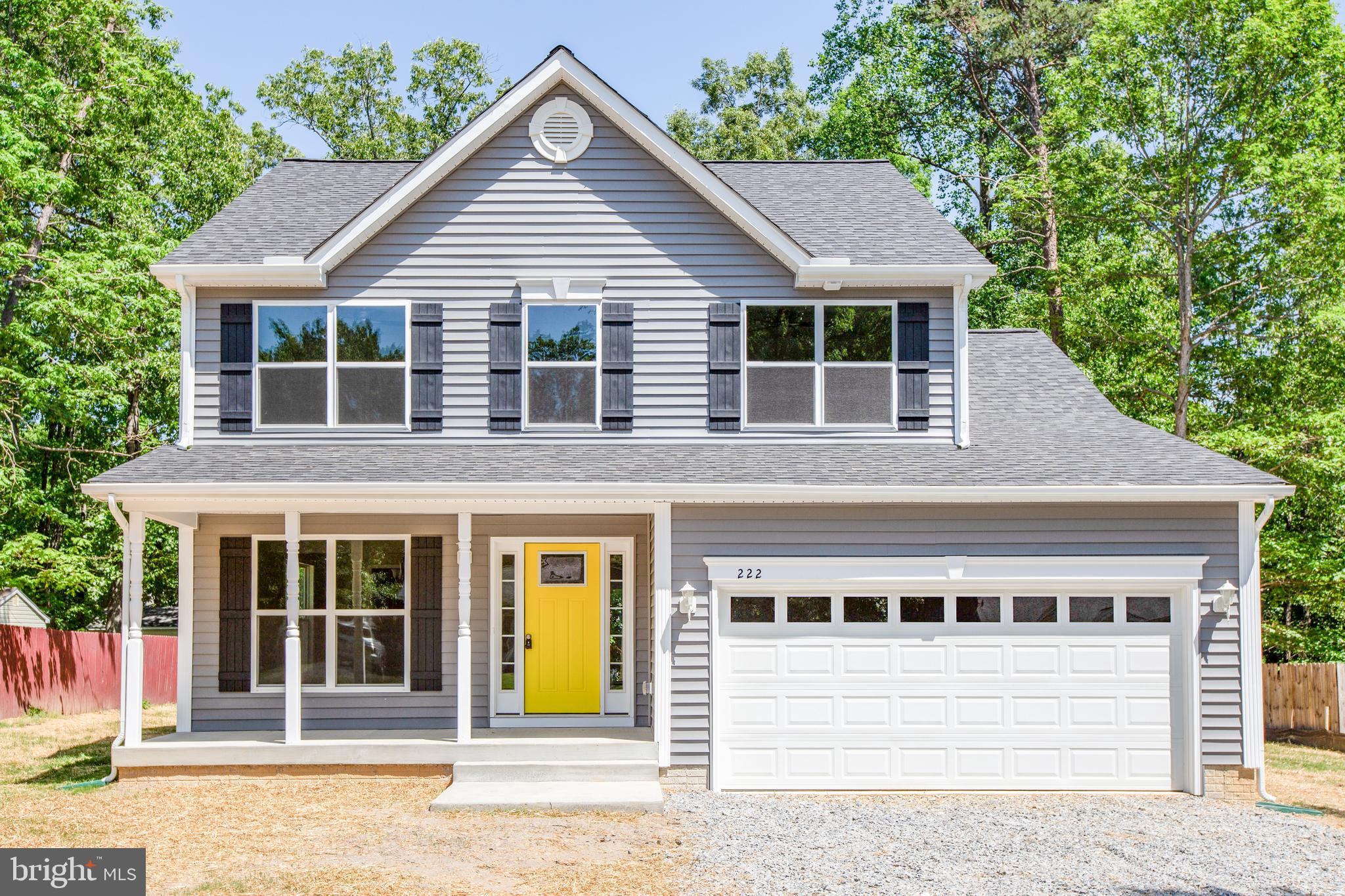 282 Circle Lane Colonial Beach, VA 22443 - Photo 57 of 57 front view of a house and a yard