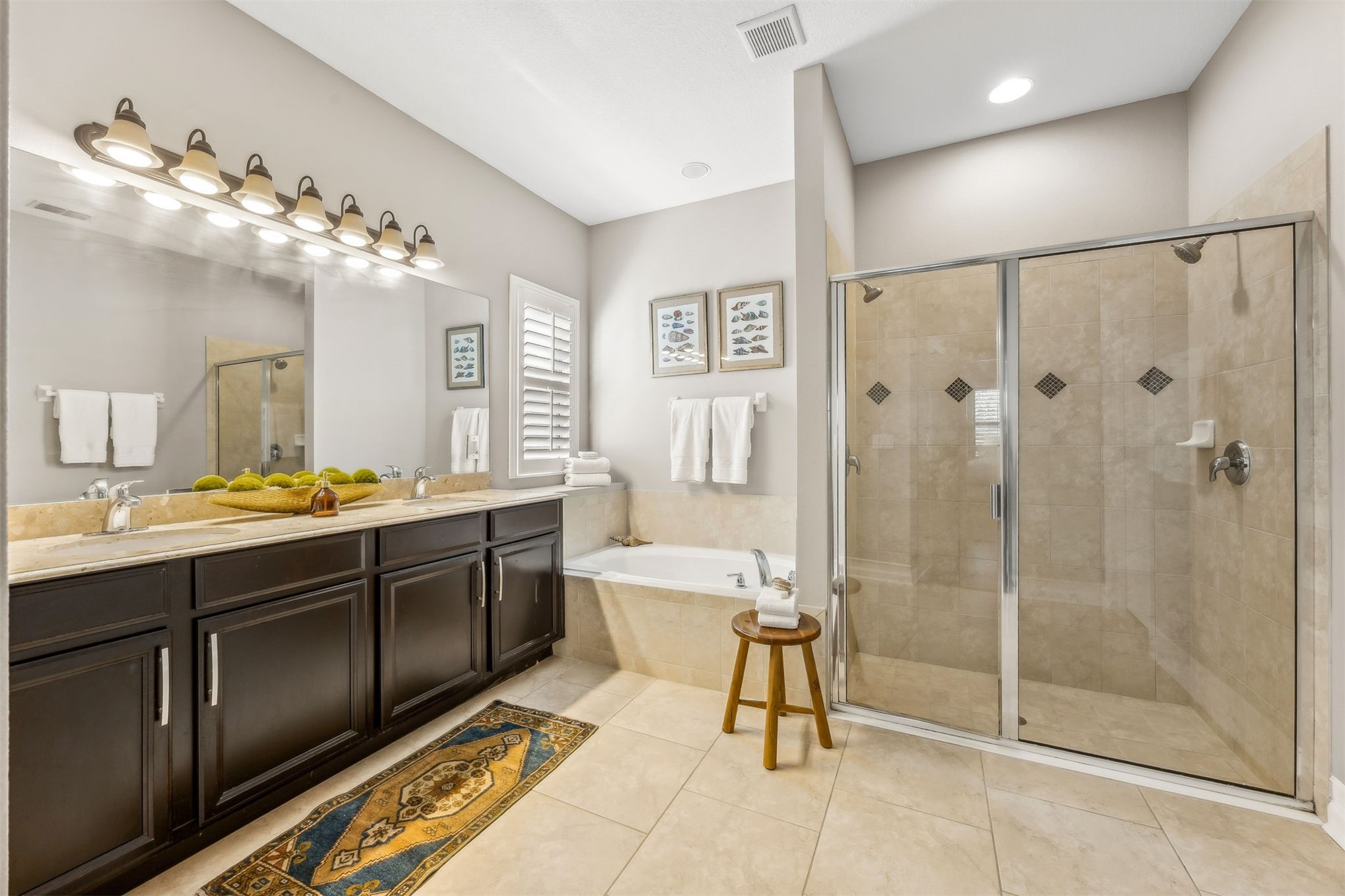 95050 Poplar Way Fernandina Beach, FL 32034 - Photo 19 of 42 a spacious bathroom with a shower sink and mirror