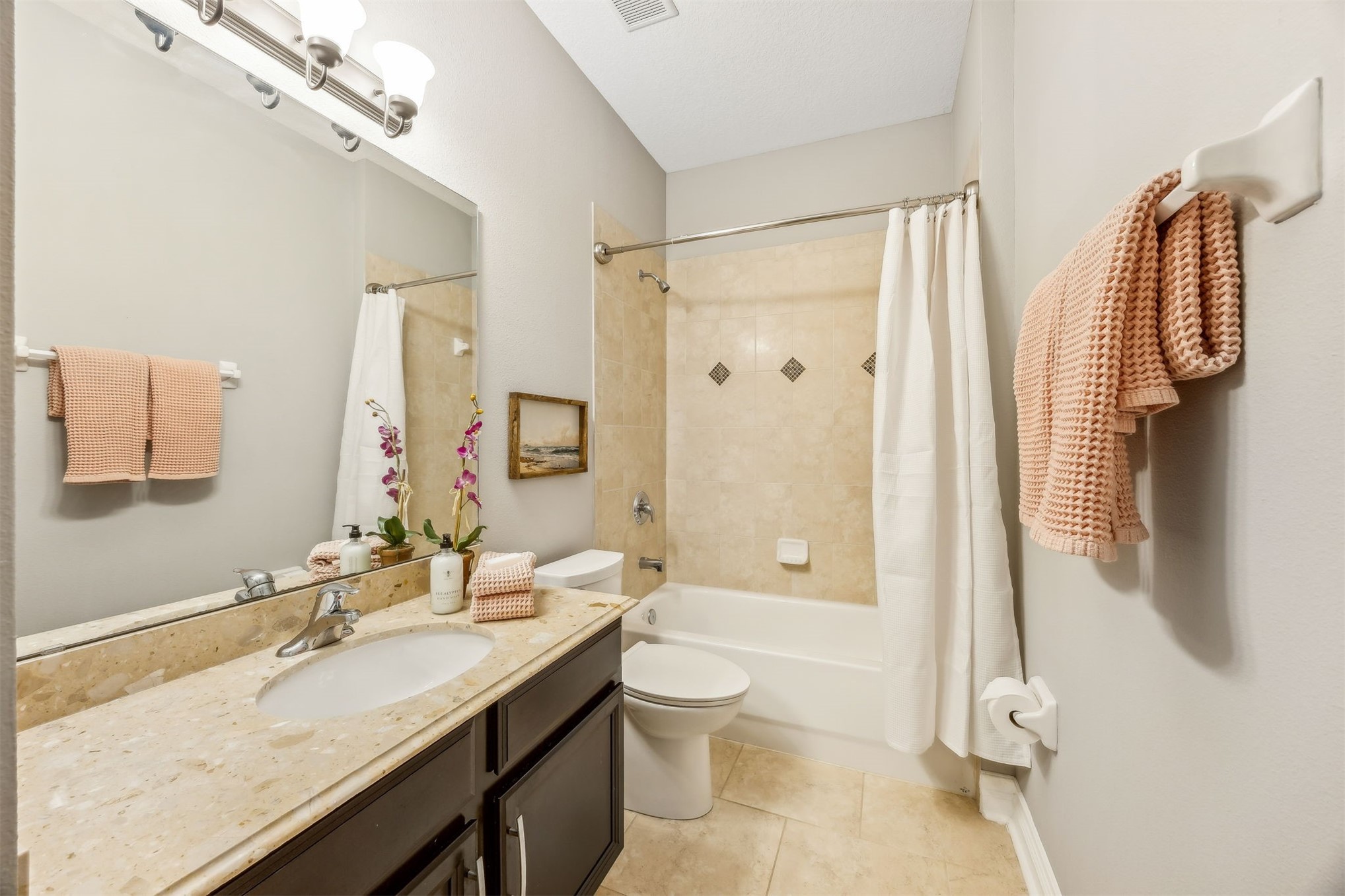 95050 Poplar Way Fernandina Beach, FL 32034 - Photo 21 of 42 a bathroom with a granite countertop sink toilet a shower and a mirror