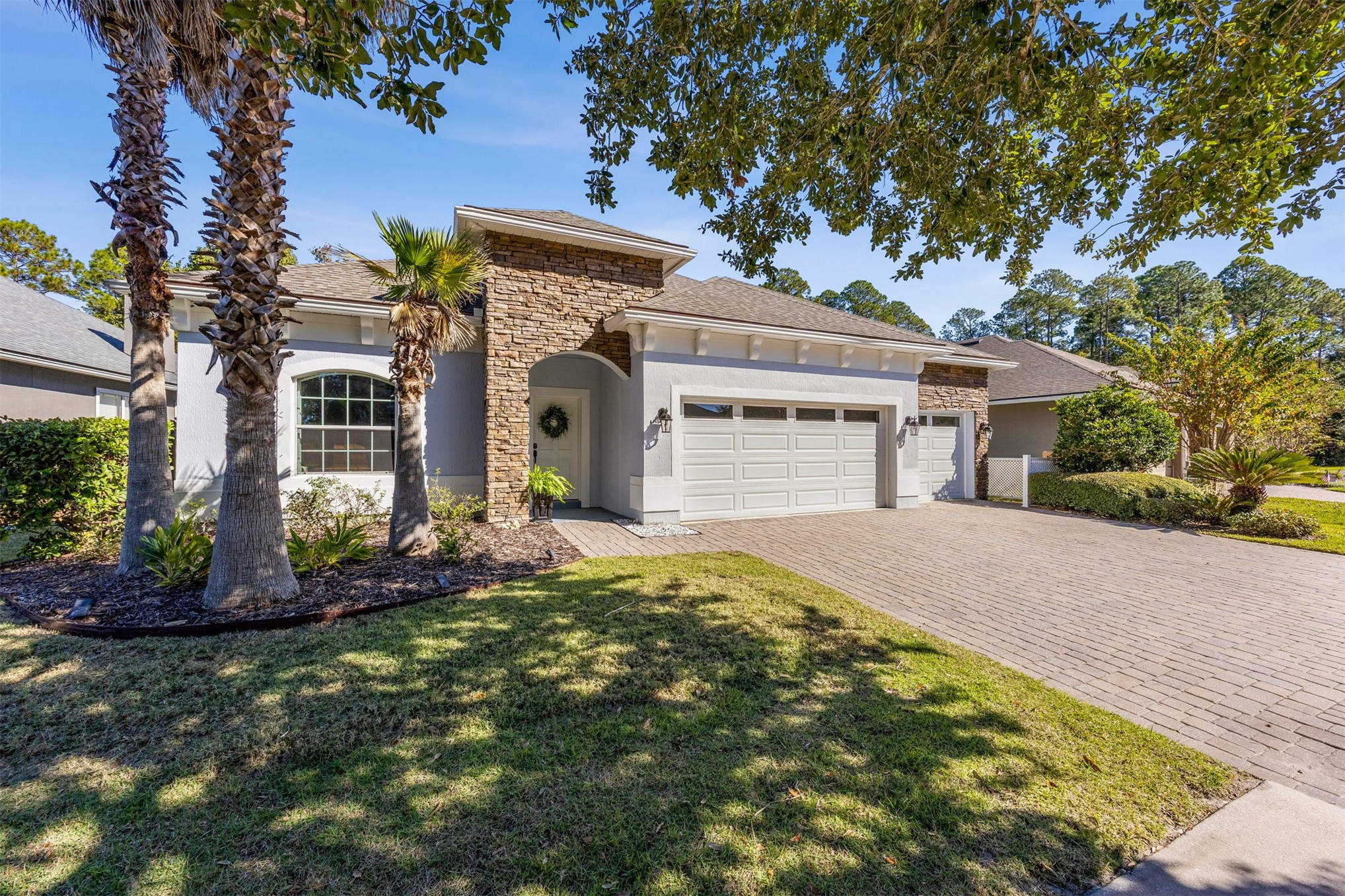 95050 Poplar Way Fernandina Beach, FL 32034 - Photo 31 of 42 a front view of a house with a garden
