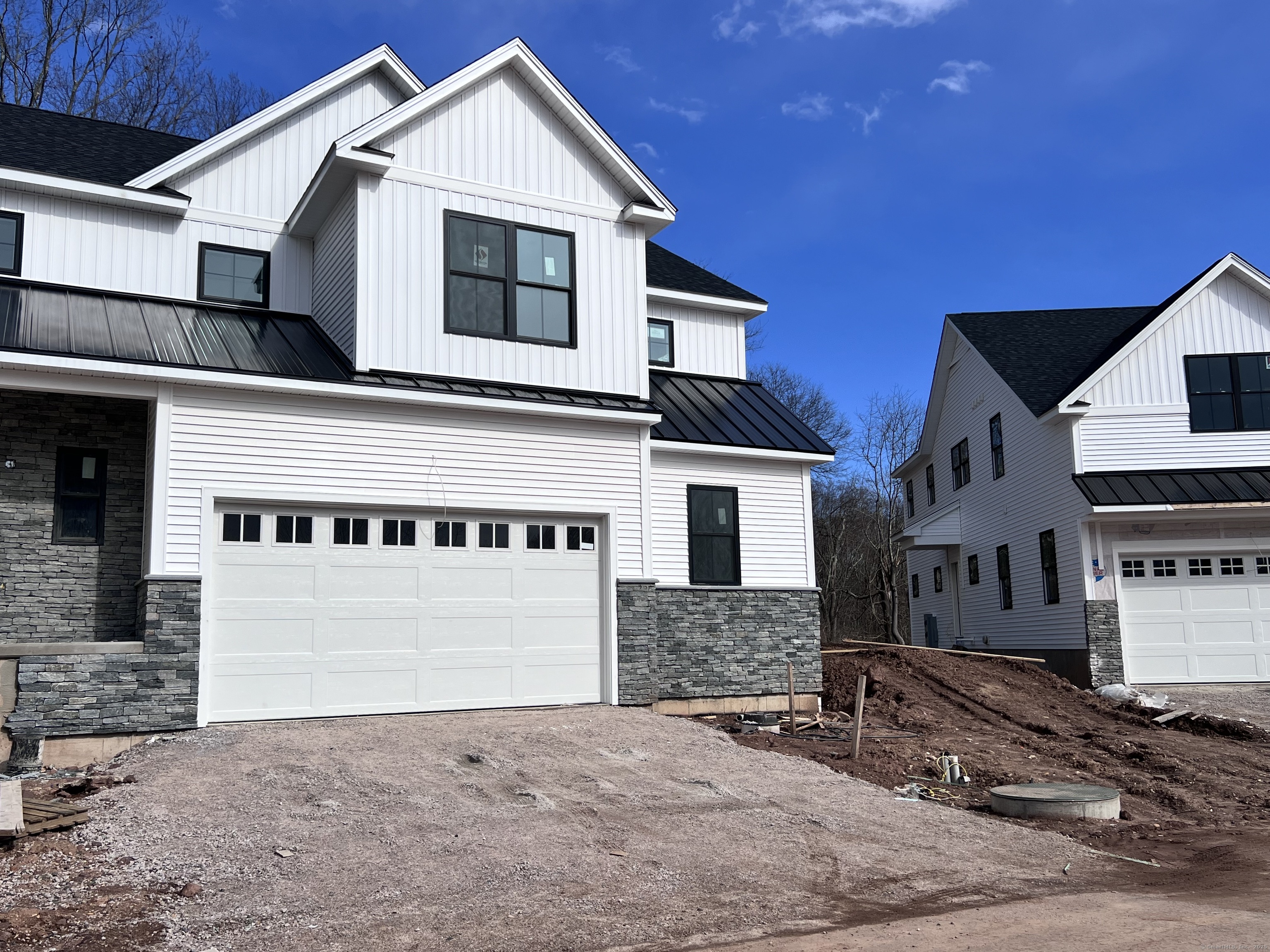 33 Village Circle, Unit 33 Guilford, CT 06437 - Photo 1 of 14 a front view of a house with a yard