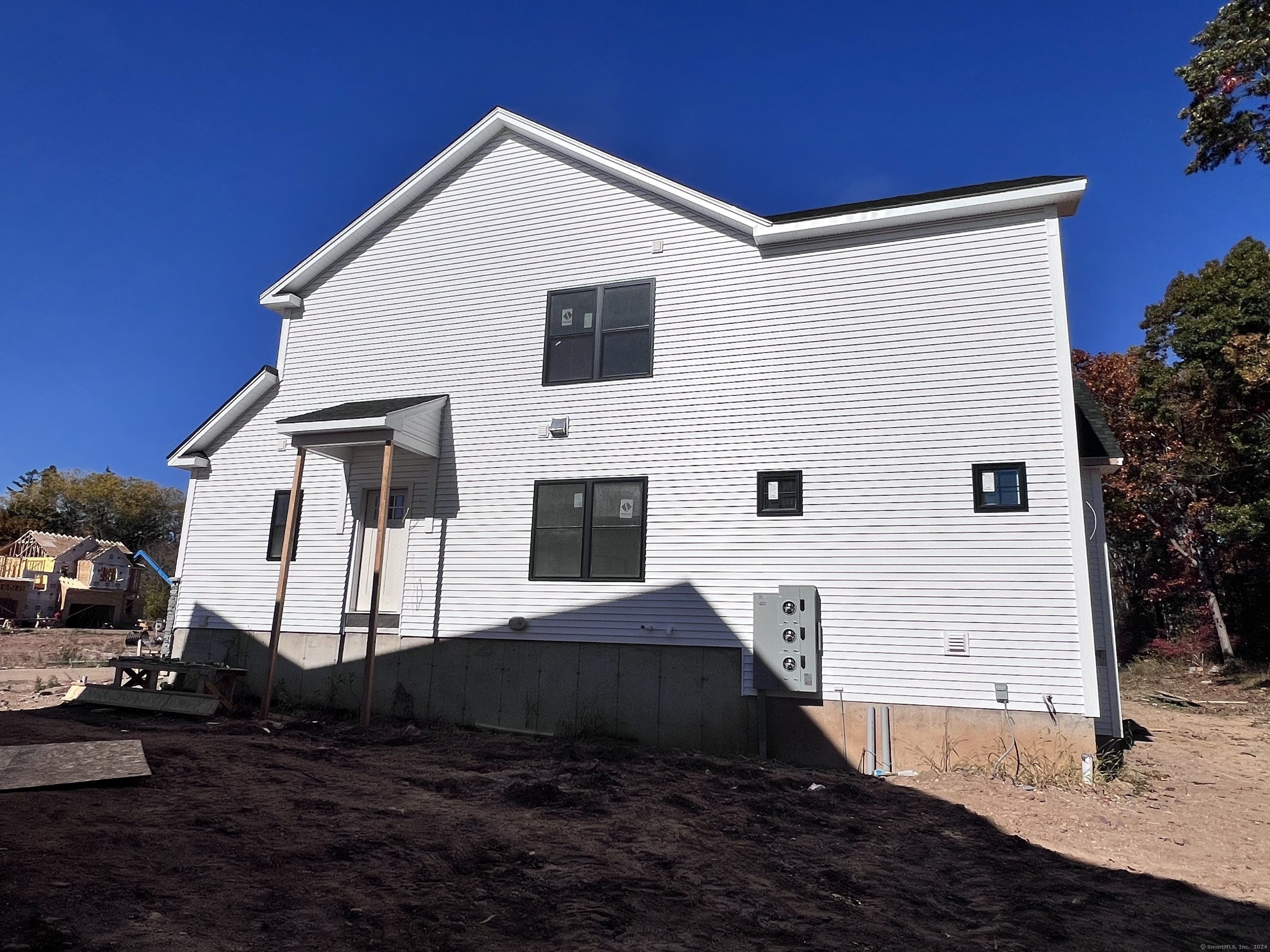 33 Village Circle, Unit 33 Guilford, CT 06437 - Photo 4 of 14 a front view of a house with a yard