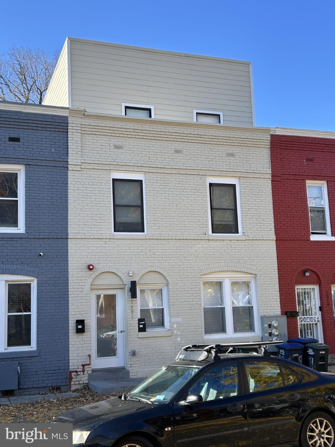 1221 Carrollsburg Place Southwest Washington, DC 20024 - Photo 2 of 3 Charming urban townhouse trio in vibrant hues.