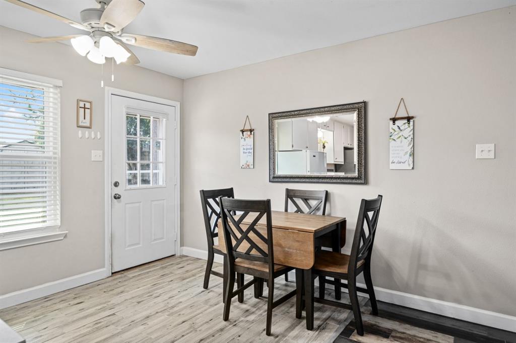 302 Santa Rosa Road, Unit R Trinidad, TX 75163 - Photo 13 of 23 a view of a dining room with furniture window and wooden floor