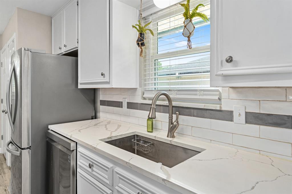 302 Santa Rosa Road, Unit R Trinidad, TX 75163 - Photo 15 of 23 a kitchen with a sink and a refrigerator
