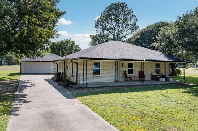 a front view of a house with swimming pool
