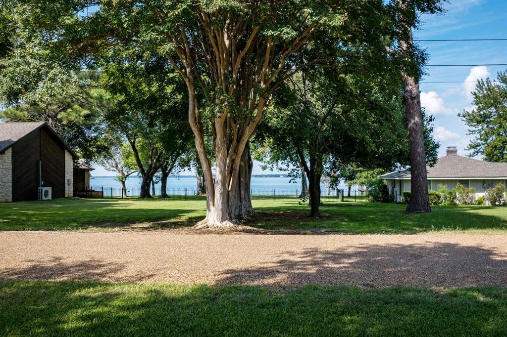 302 Santa Rosa Road, Unit R Trinidad, TX 75163 - Photo 7 of 23 a view of a yard with a house