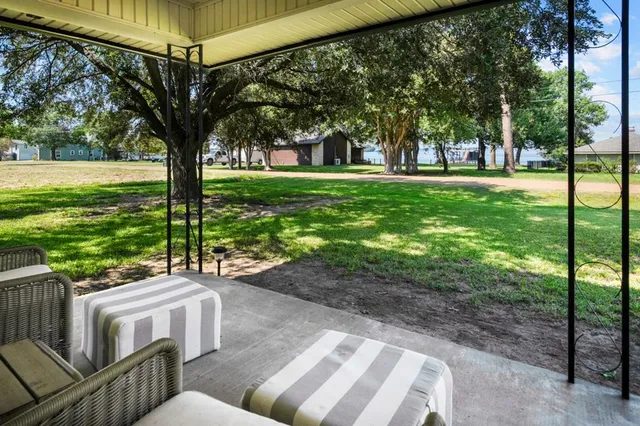 a view of a two chairs in a park