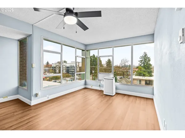 a view of an empty room with a window