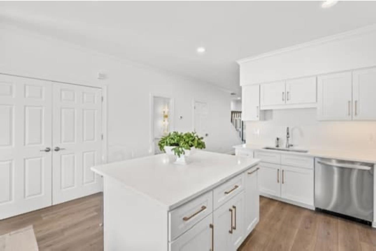 1687 Kimbrough Road, Unit 1687 Germantown, TN 38138 - Photo 3 of 19 Kitchen with dishwasher, white cabinets, recessed lighting, light wood finished floors, and crown molding