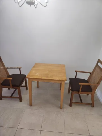a room with a table and chairs