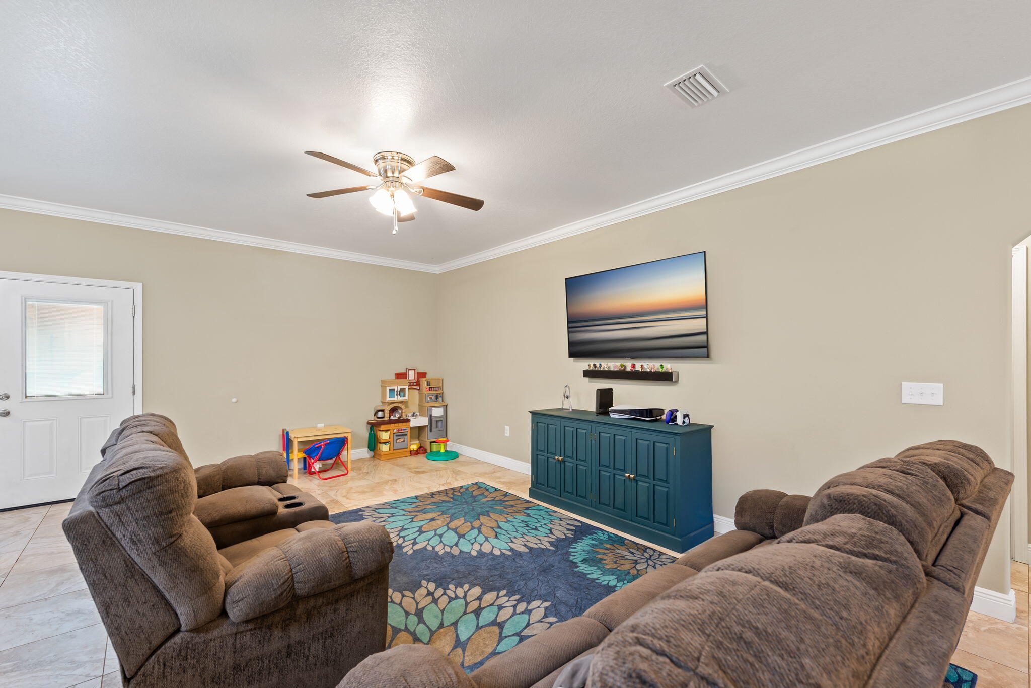 765 Ridge Lake Road Crestview, FL 32536 - Photo 11 of 46 a bedroom with furniture and a flat screen tv