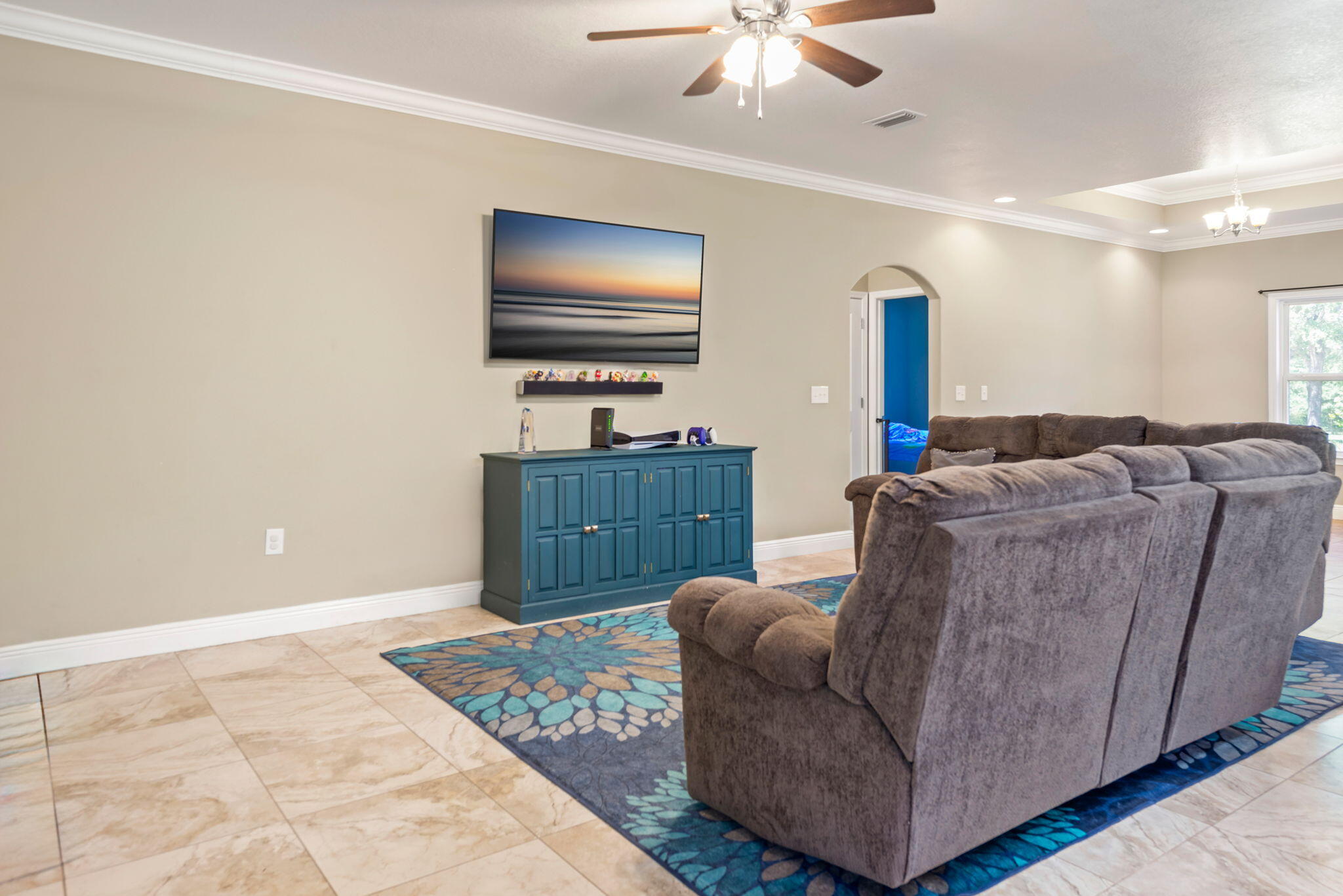 765 Ridge Lake Road Crestview, FL 32536 - Photo 12 of 46 a living room with furniture and a flat screen tv