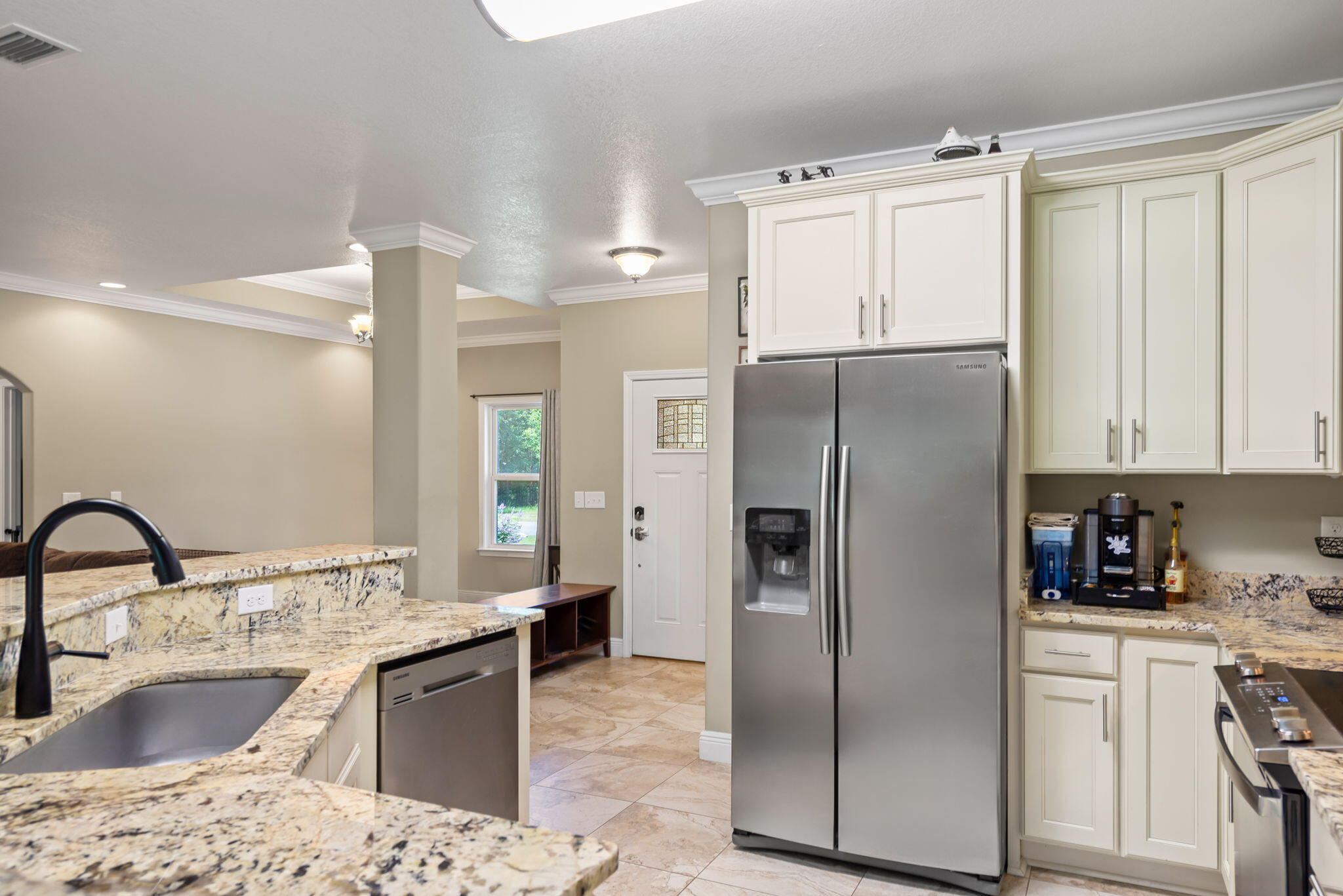 765 Ridge Lake Road Crestview, FL 32536 - Photo 13 of 46 a kitchen with a refrigerator sink and stove