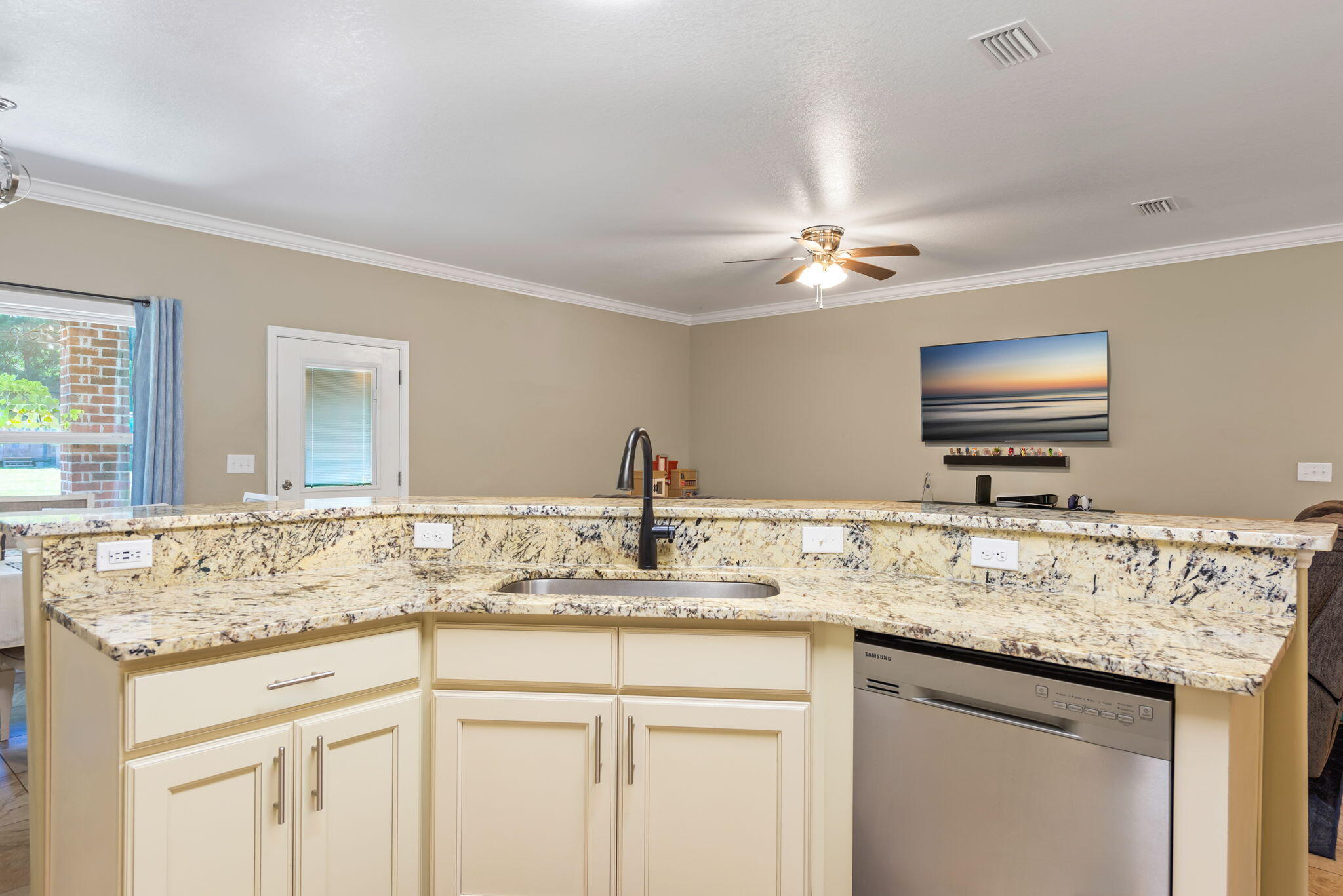 765 Ridge Lake Road Crestview, FL 32536 - Photo 14 of 46 a bathroom with a granite countertop sink a large mirror and a window