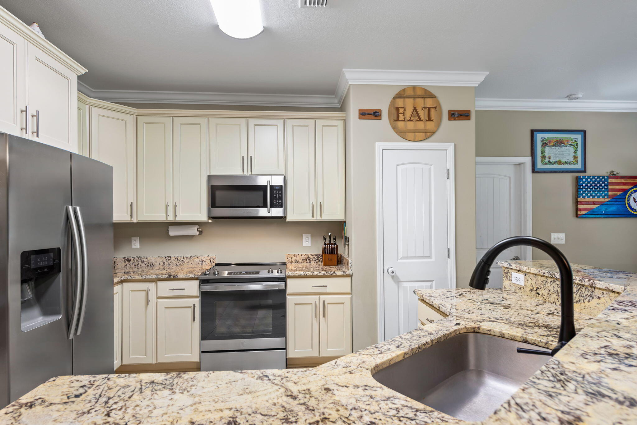 765 Ridge Lake Road Crestview, FL 32536 - Photo 15 of 46 a kitchen with stainless steel appliances granite countertop a stove a refrigerator and a sink