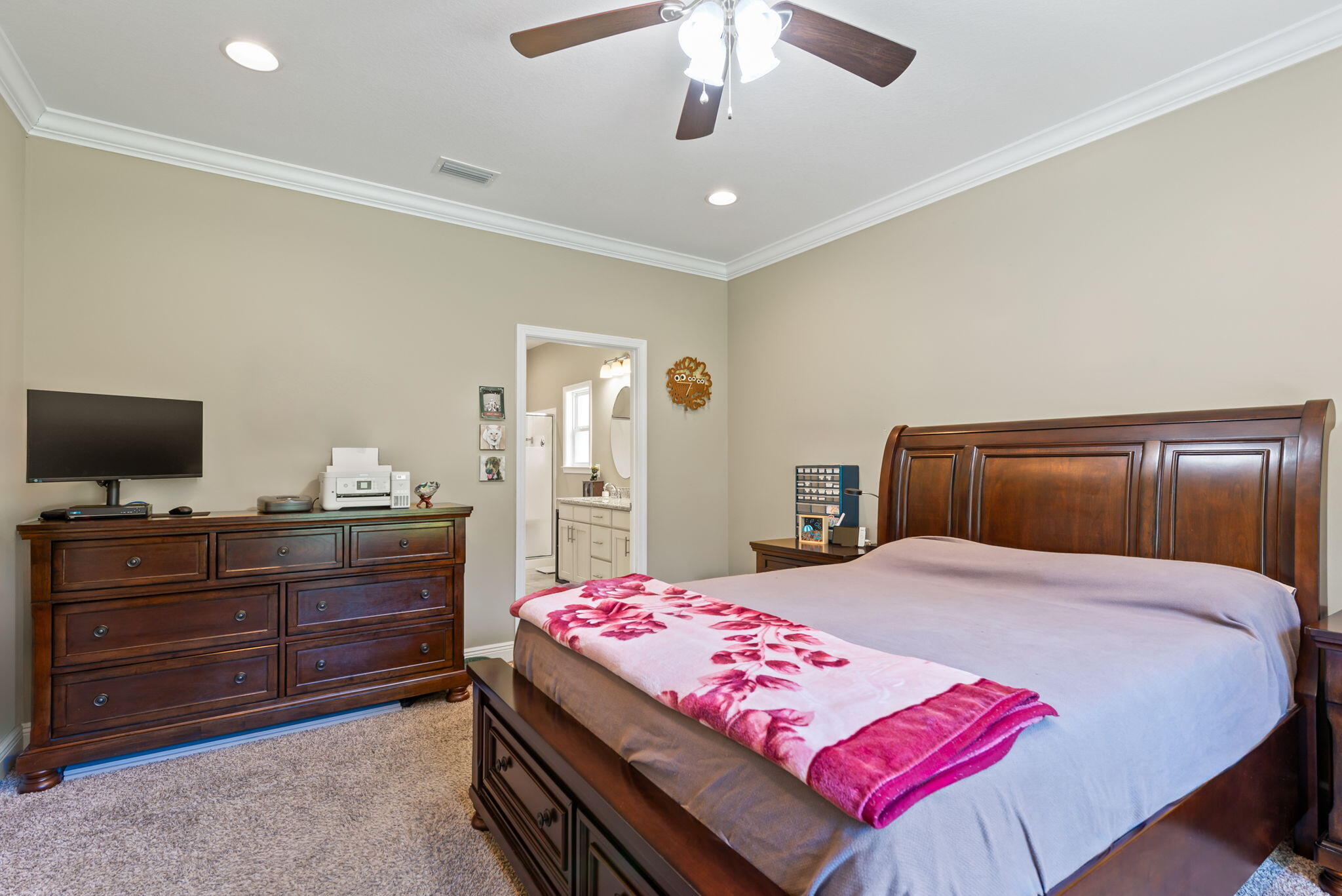 765 Ridge Lake Road Crestview, FL 32536 - Photo 21 of 46 a bedroom with a bed and a flat screen tv