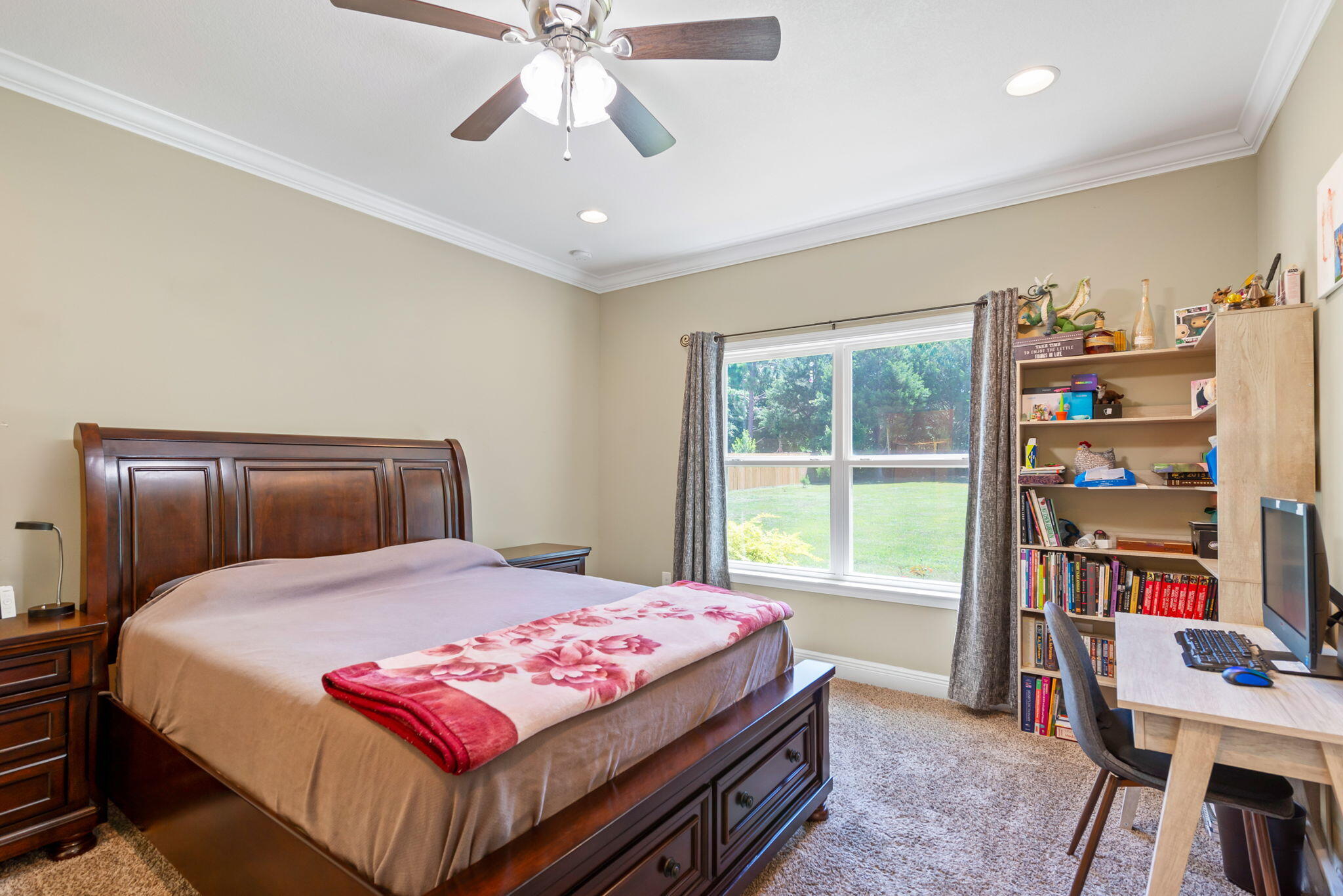 765 Ridge Lake Road Crestview, FL 32536 - Photo 23 of 46 a bedroom with a bed a book shelf and a window