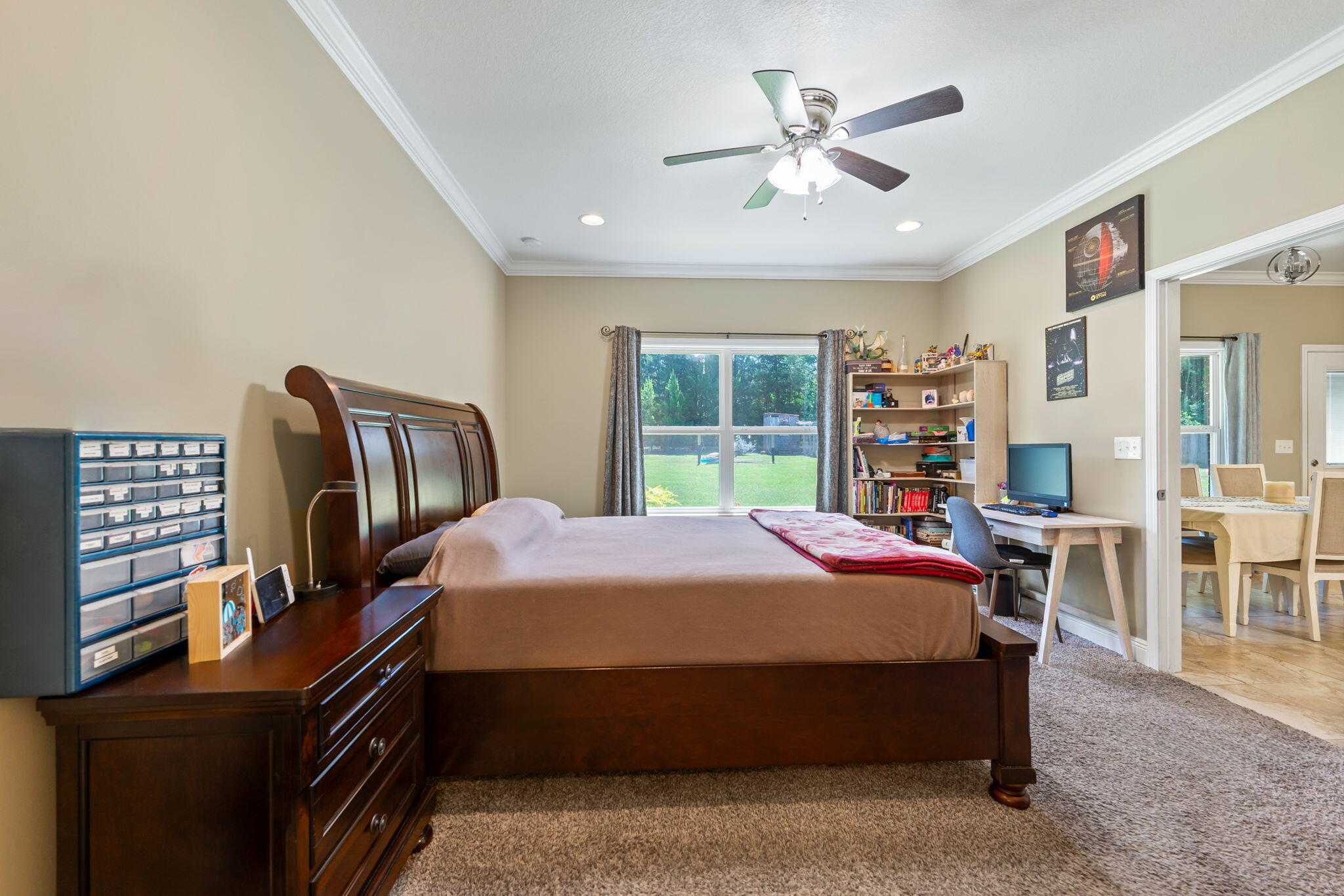 765 Ridge Lake Road Crestview, FL 32536 - Photo 24 of 46 a bedroom with a bed table and window