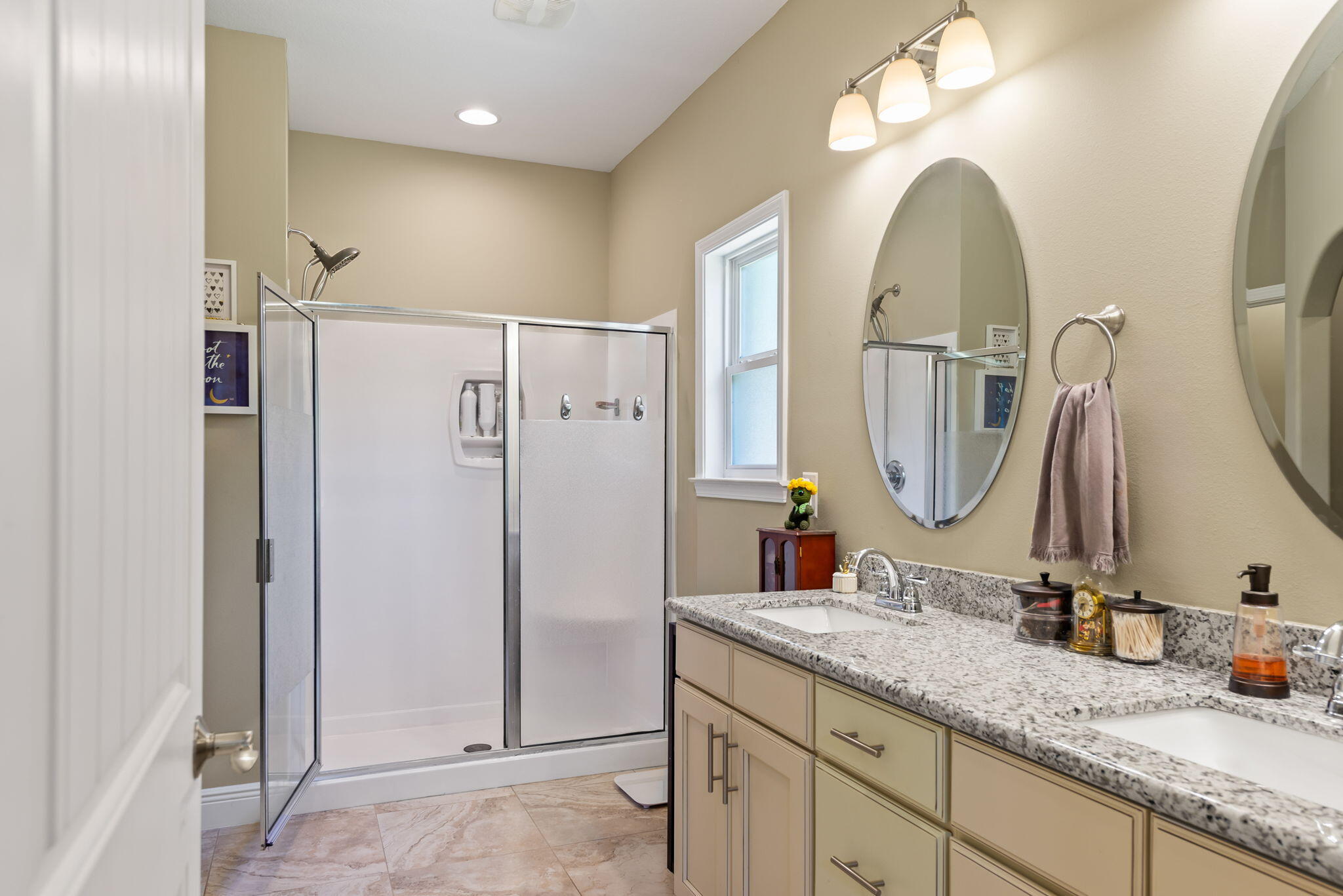 765 Ridge Lake Road Crestview, FL 32536 - Photo 26 of 46 a bathroom with a double vanity sink and a mirror