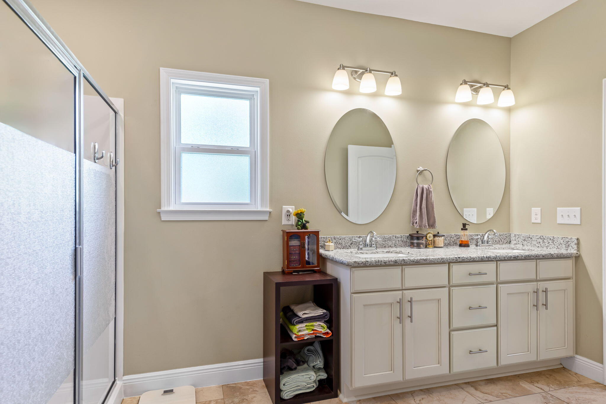 765 Ridge Lake Road Crestview, FL 32536 - Photo 27 of 46 a bathroom with a double vanity sink and a mirror