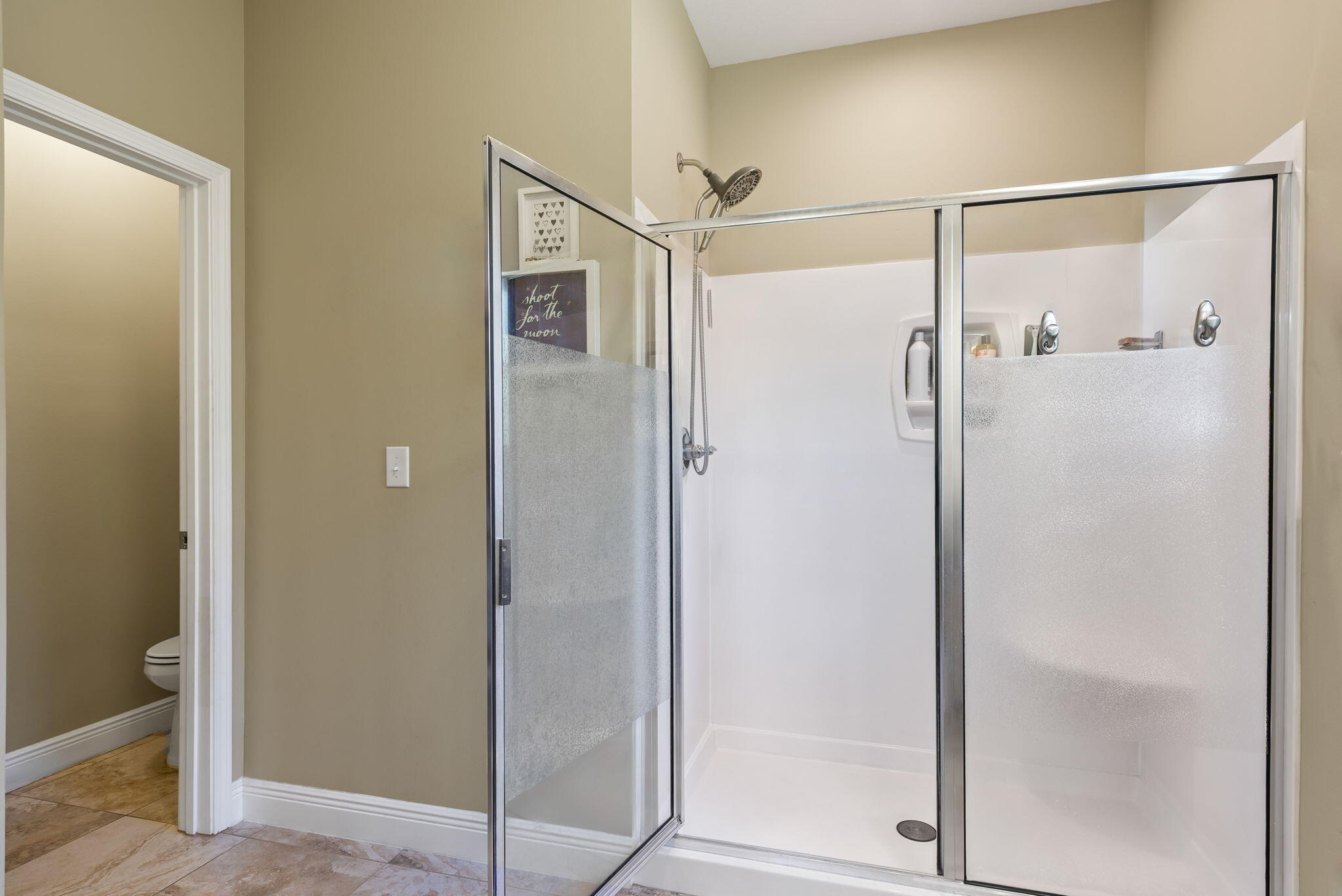 765 Ridge Lake Road Crestview, FL 32536 - Photo 29 of 46 a bathroom with a glass shower door
