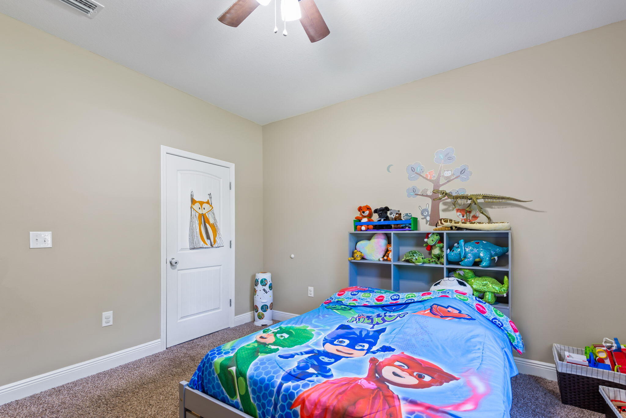 765 Ridge Lake Road Crestview, FL 32536 - Photo 31 of 46 a bedroom with a bed and a chandelier