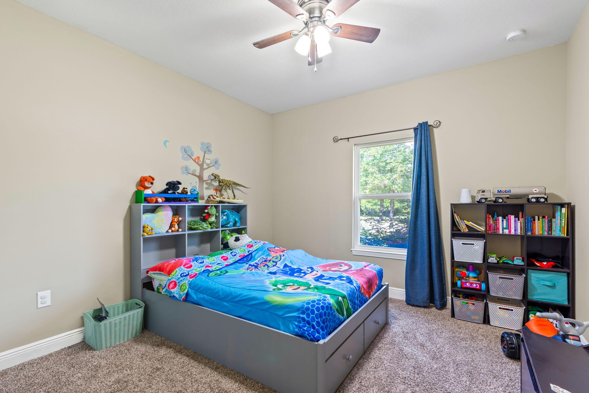 765 Ridge Lake Road Crestview, FL 32536 - Photo 32 of 46 a bedroom with a bed table and a window