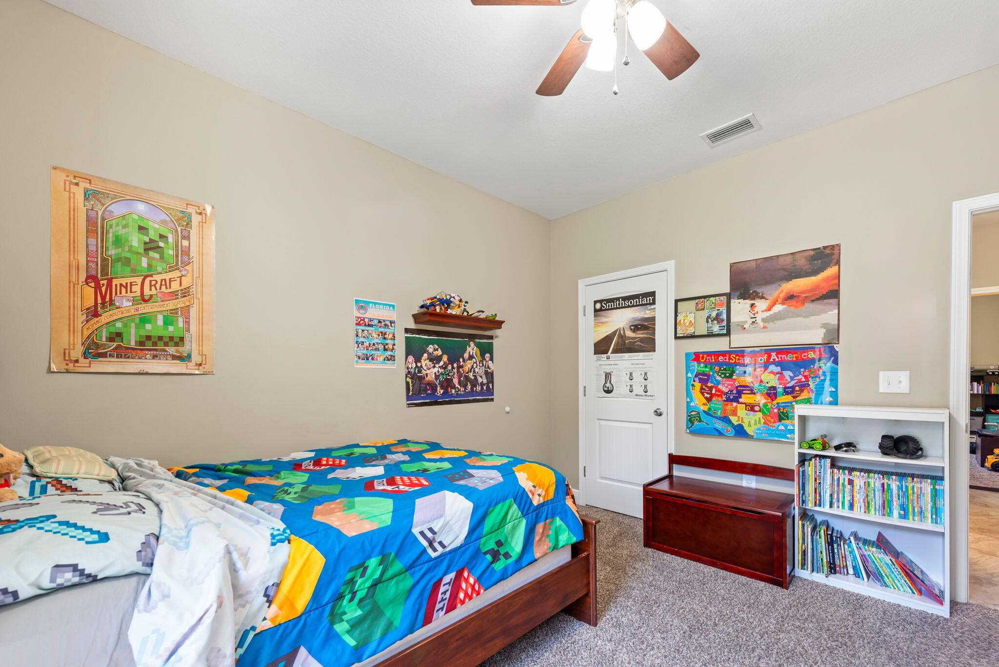 765 Ridge Lake Road Crestview, FL 32536 - Photo 33 of 46 a bedroom with a bed and a bookshelf