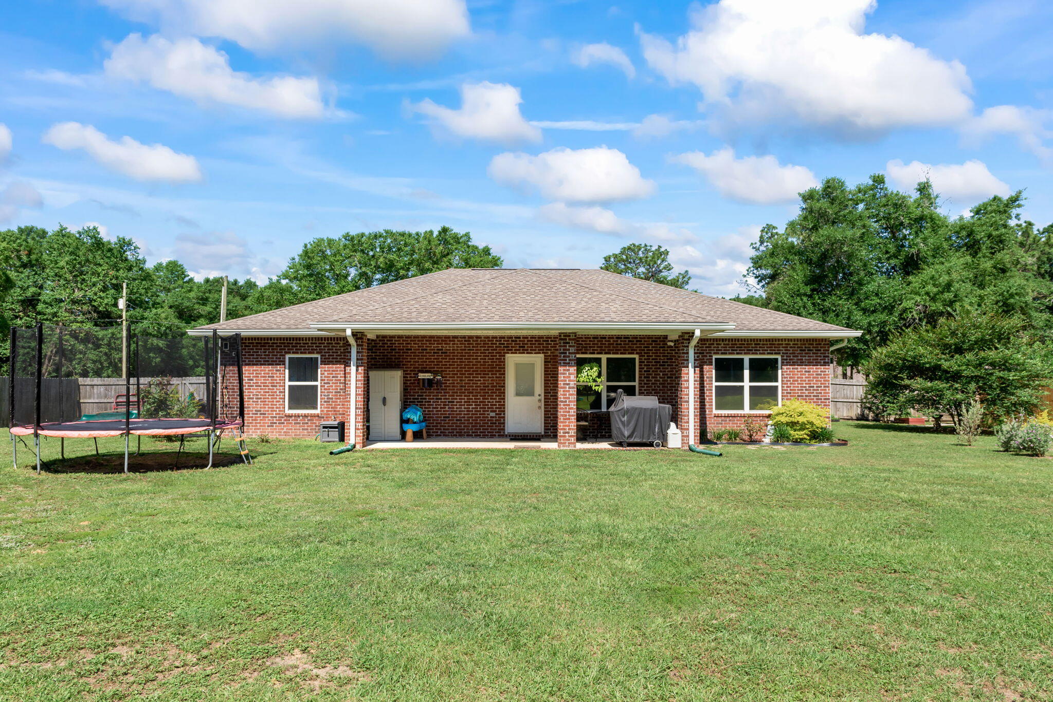 765 Ridge Lake Road Crestview, FL 32536 - Photo 37 of 46 a view of a house with a yard