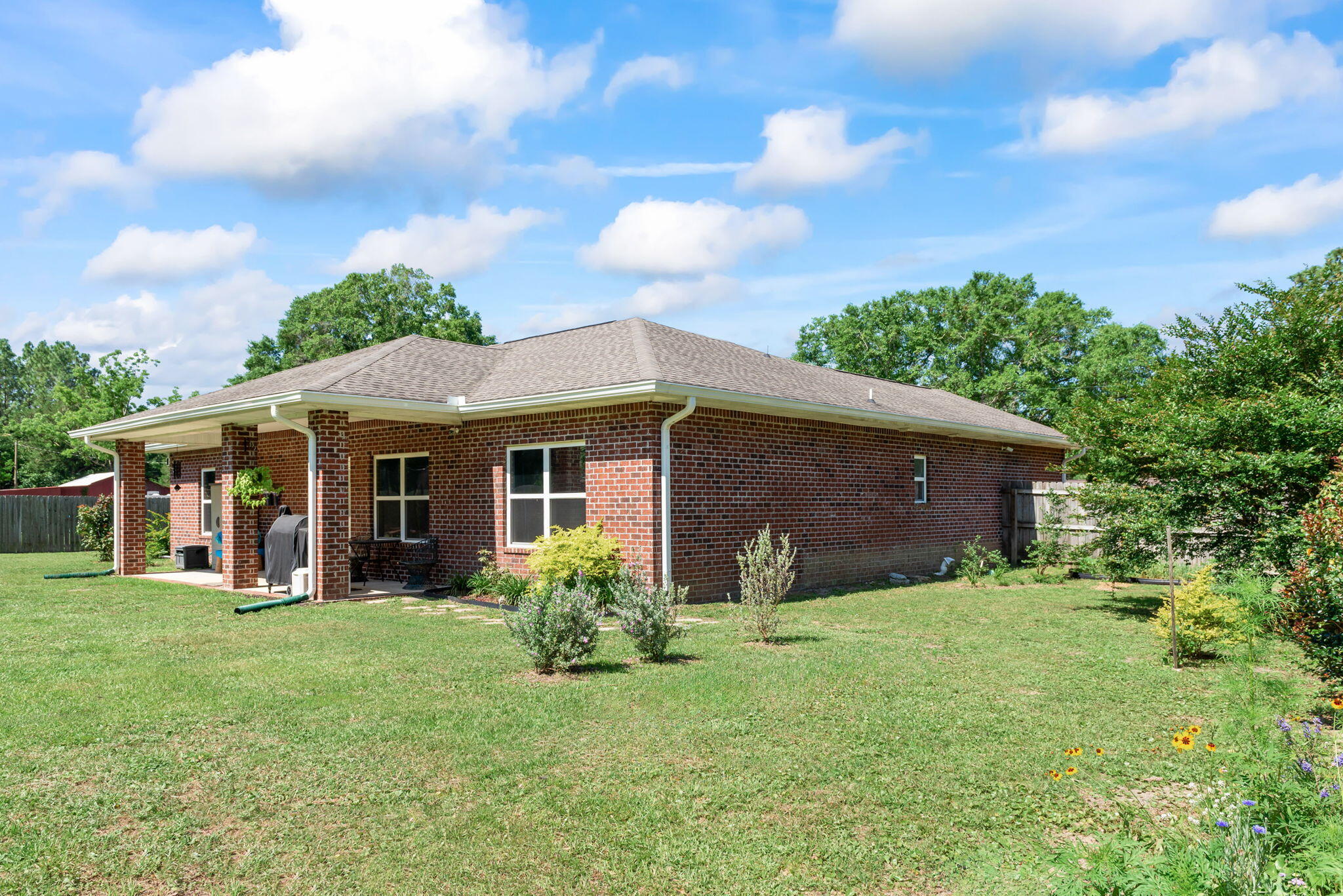 765 Ridge Lake Road Crestview, FL 32536 - Photo 38 of 46 a view of a house with yard and sitting area