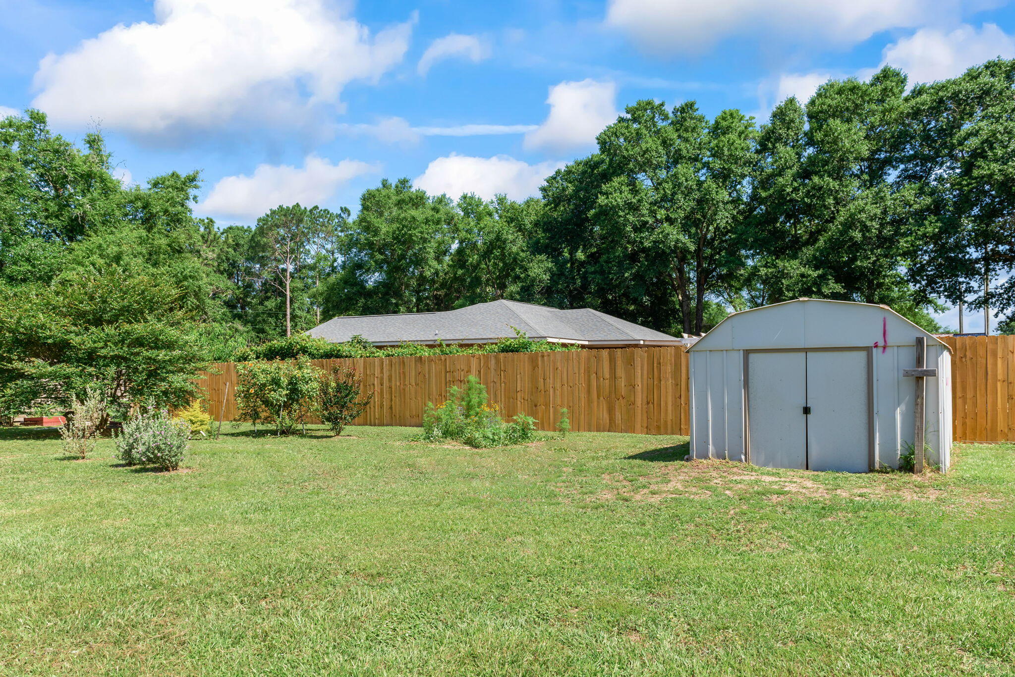765 Ridge Lake Road Crestview, FL 32536 - Photo 41 of 46 a view of a backyard of the house