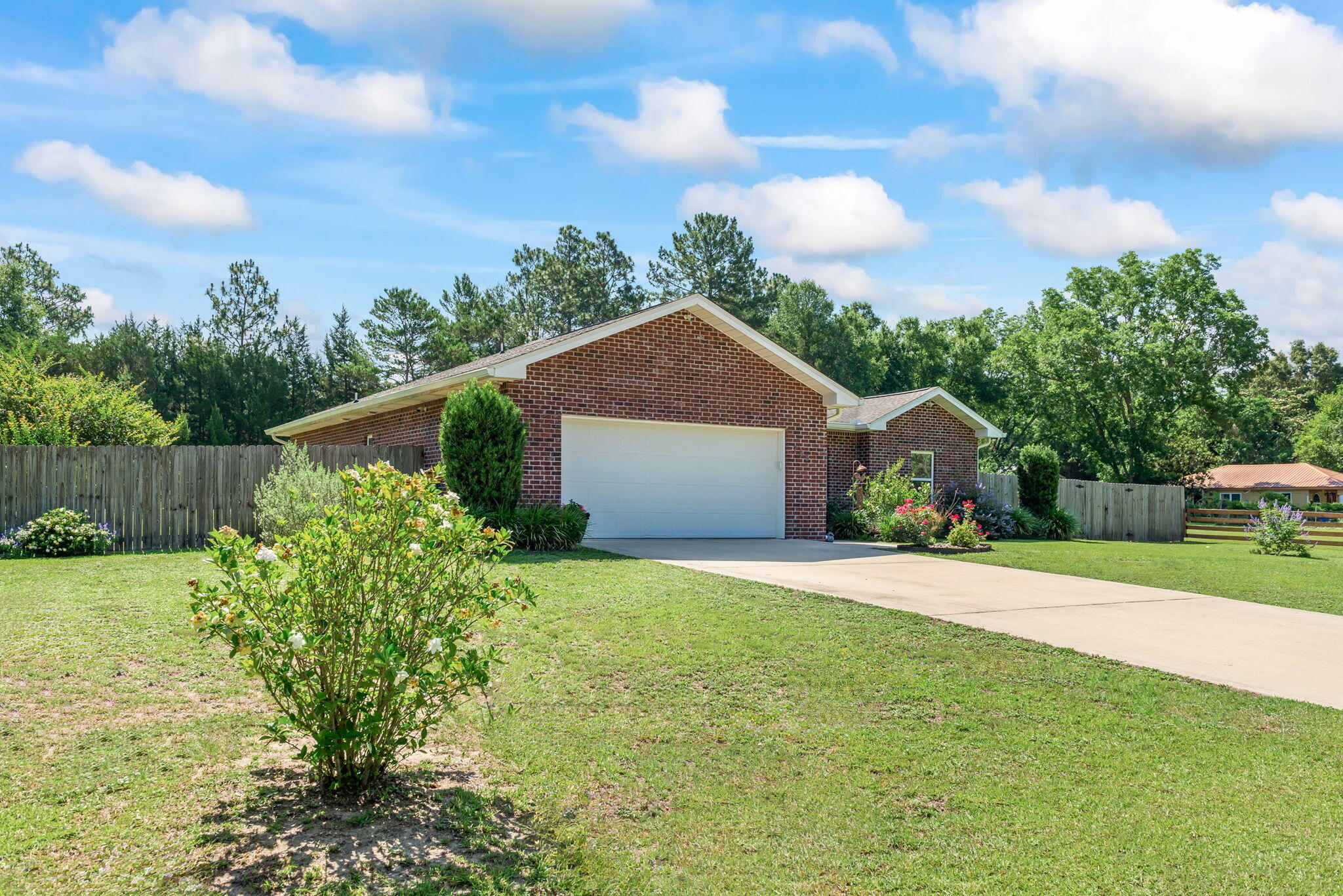 765 Ridge Lake Road Crestview, FL 32536 - Photo 5 of 46 a front view of a house with garden