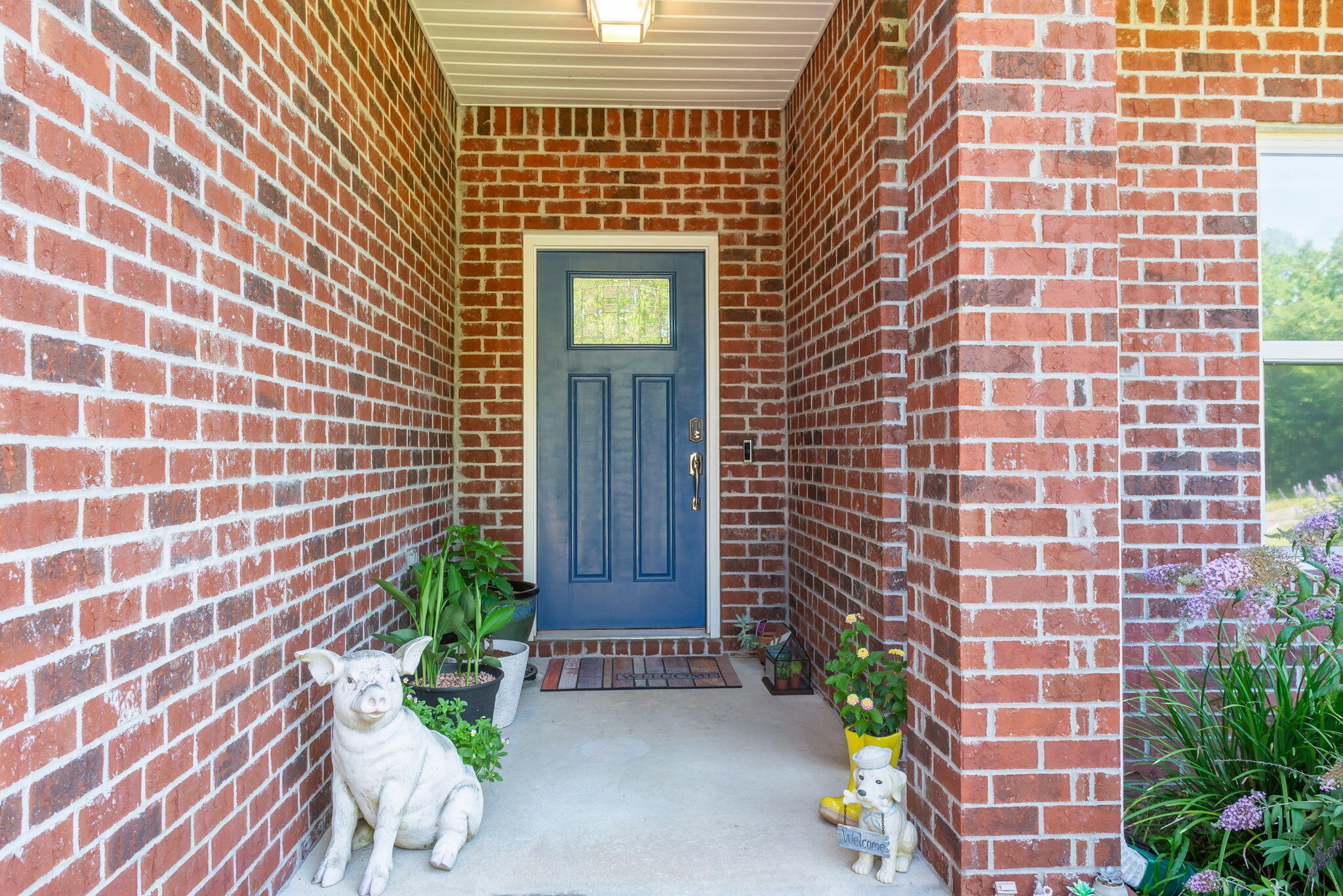 765 Ridge Lake Road Crestview, FL 32536 - Photo 7 of 46 a brick building with a potted plant in front of door