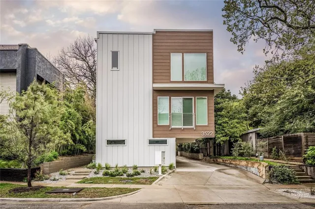 a front view of a house with yard