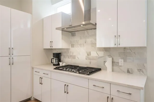 a kitchen with cabinets appliances and a counter top space