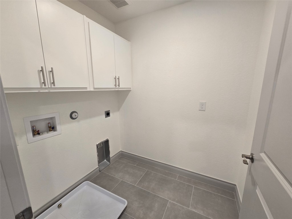 2105 Tiger Trail, Unit 702 Round Rock, TX 78664 - Photo 18 of 22 a view of storage and utility room with washer and dryer